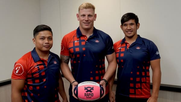 Malaysian players Badrul Bin Muktee (left) and Samuel Meran (right) with Valke Captain Shane Kirkwood (Centre)